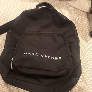Marc Jacobs black canvas backpack with wide band backnstraps for comfort.